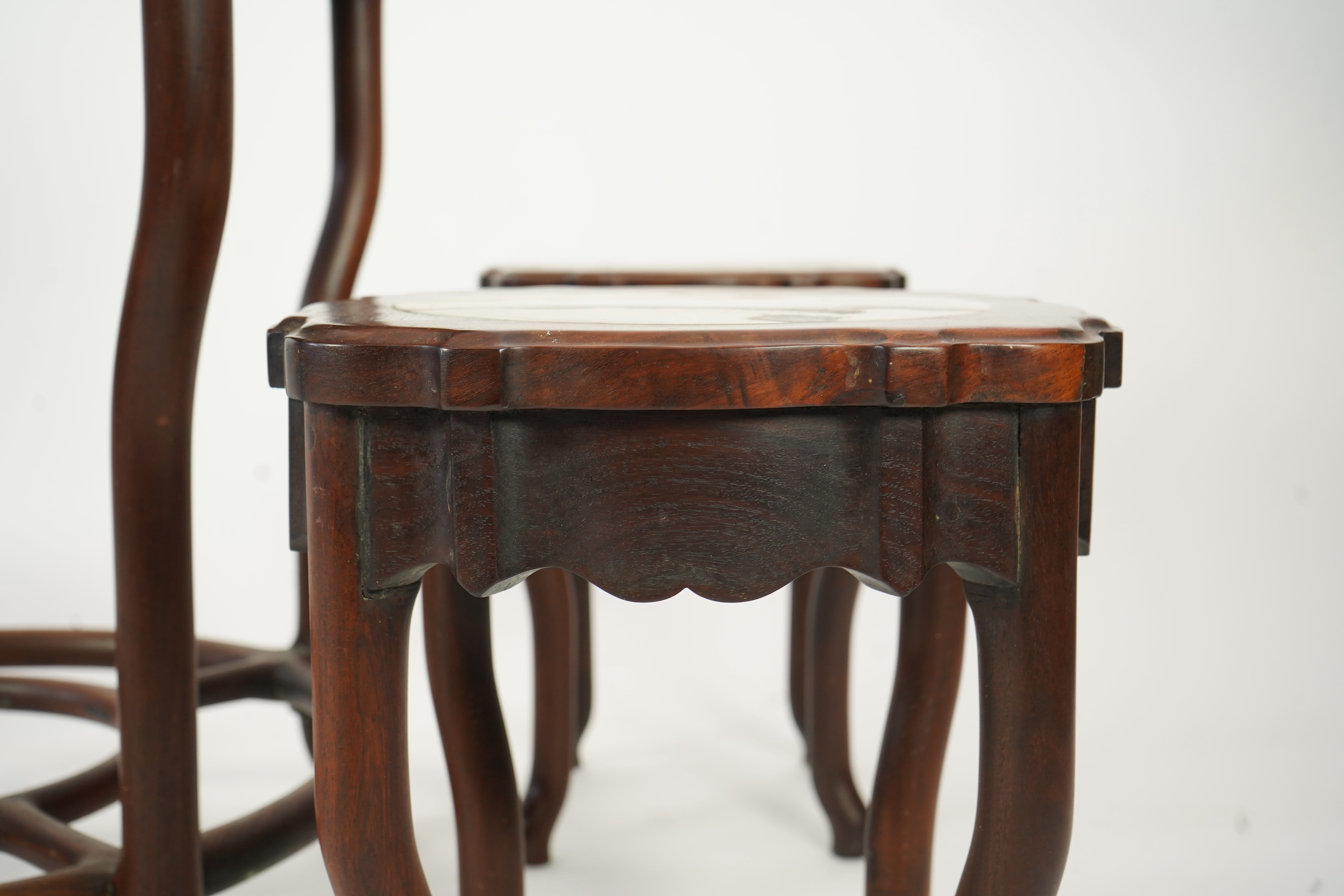 A Chinese dreamstone marble inset hongmu table and four matching stools